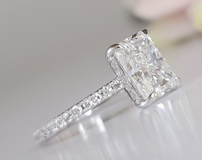 IGI certified 2.50 Carat Elongated Radiant Cut CVD lab grown diamond set in a classic cathedral hidden halo diamond pave setting