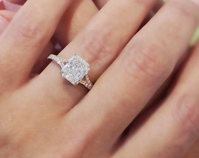 This classic 14K rose gold split shank setting features a 2 carat IGI certified CVD lab grown diamond & 0.42 carats accent diamonds