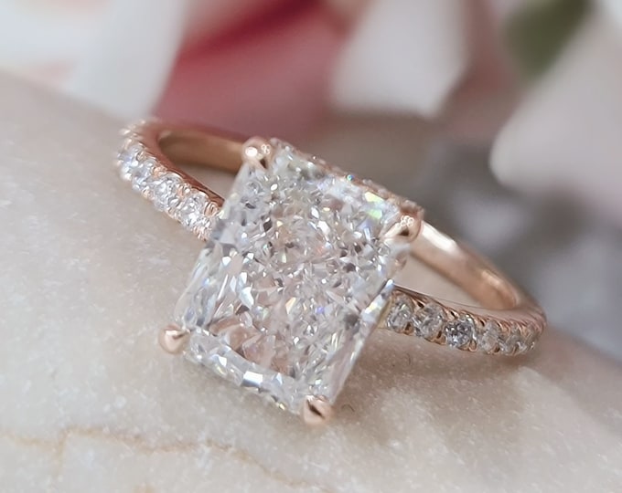 This 14k Rose Gold Unique invisible gallery and hidden halo diamond setting features a 3ct Carat Radiant Cut IGI Certified CVD lab grown diamond