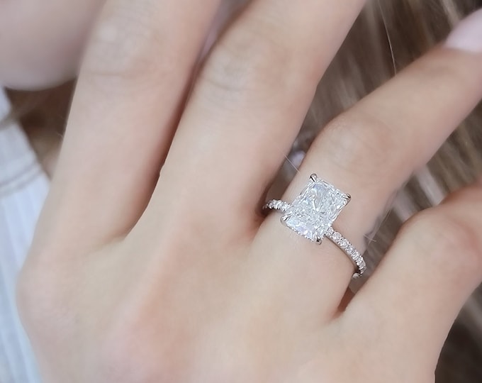 This 14k white gold hidden halo diamond setting features a 3 Carat Radiant Cut IGI Certified CVD lab grown diamond