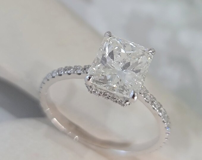 IGI certified 2 Carat Radiant Cut CVD lab grown diamond set in a classic low profile hidden halo diamond pave setting