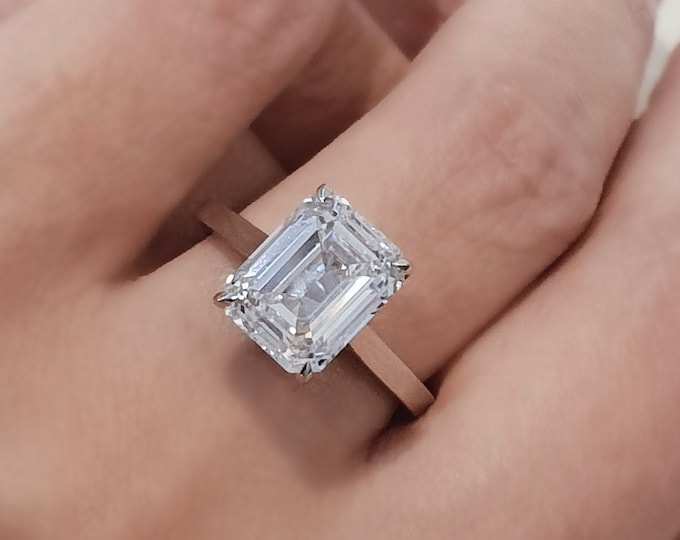 This classic 14K white gold cathedral setting features a 3 carat IGI certified CVD lab grown Emerald cut diamond