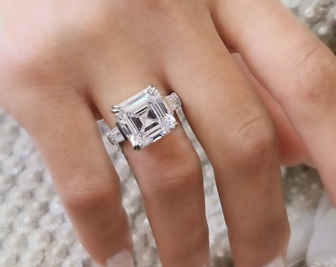 This unique multi stone platinum ring features an 8 Carat Asscher Cut IGI certified CVD lab grown Diamond and 0.80 carats tapered baguette side stones