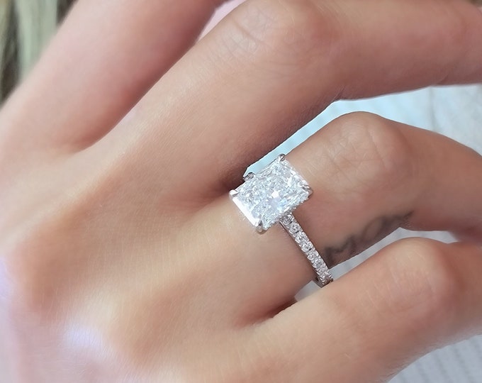 IGI certified 2.50 Carat Elongated Radiant Cut CVD lab grown diamond set in a classic cathedral hidden halo diamond pave setting