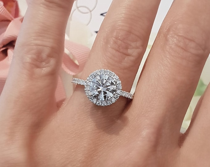 This unique Diamond halo pave setting features a 2 Carat Round Cut IGI certified CVD lab grown diamond