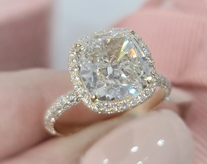 This unique double edge halo 14K gold diamond setting features a 2.50 carat IGI certified CVD lab grown cushion cut diamond & 0.75 carats accent diamonds