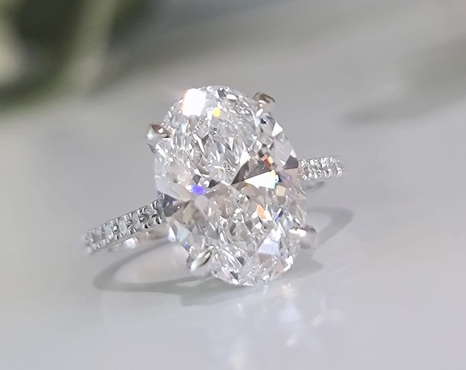 4 Carat Oval Cut IGI Certified CVD Lab Grown Diamond set in a unique Cathedral hidden halo and diamond pave setting