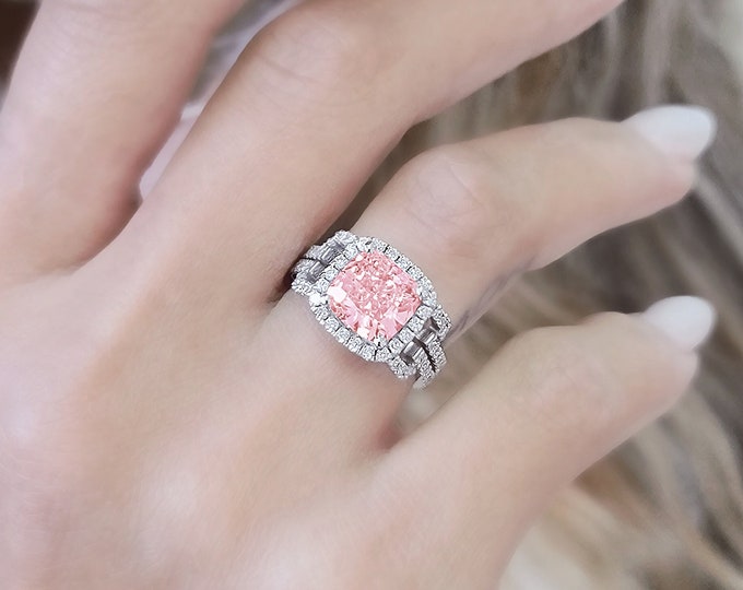 This unique split shank with pave diamond & halo setting features a 4 Carat Pink Cushion Cut IGI Certified CVD lab grown diamond and 0.76 carats accent diamonds