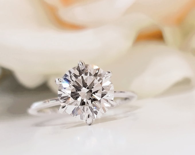 This classic timeless 6 prongs white gold solitaire setting features a 2.50ct IGI Certified ideal cut CVD lab grown round brilliant cut diamond