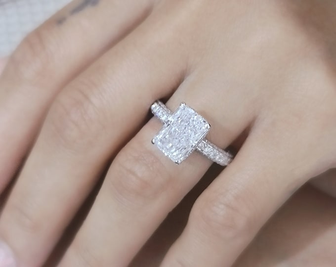 This Elegant white gold 3D pave diamond setting features 1.50 carats accent diamonds and a 4 carat IGI Certified CVD lab grown elongated Radiant cut diamond