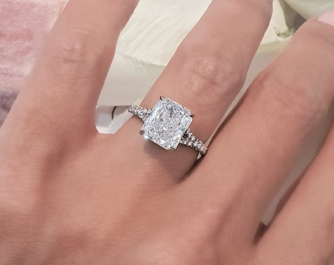 This elegant split shank diamond setting features a 3 carat radiant cut IGI certified CVD lab grown diamond