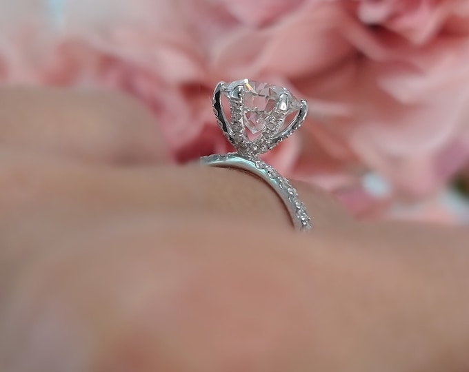2 Carat Round Cut IGI Certified CVD Lab grown diamond set in a delicate 0.40 carats diamond pave setting with diamonds running up the prongs