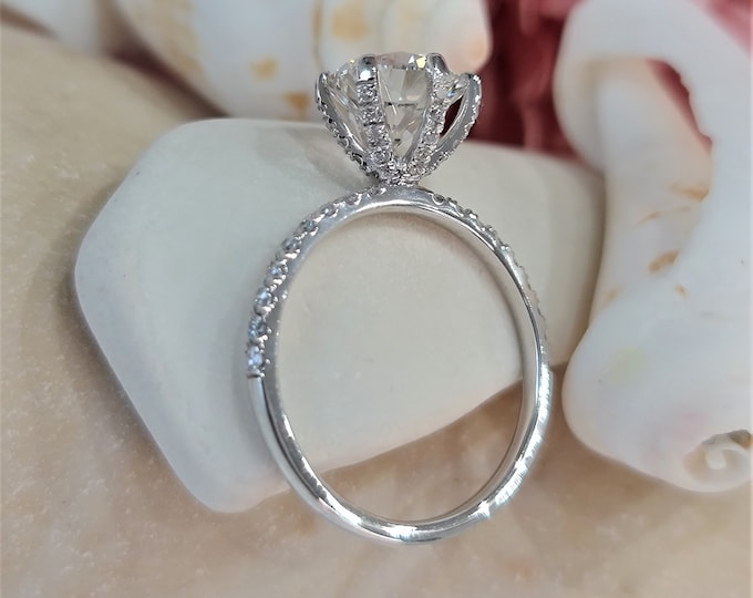 2.25 Carat Round Cut IGI Certified CVD Lab grown diamond set in a delicate 0.40 carats diamond pave setting with diamonds running up the prongs