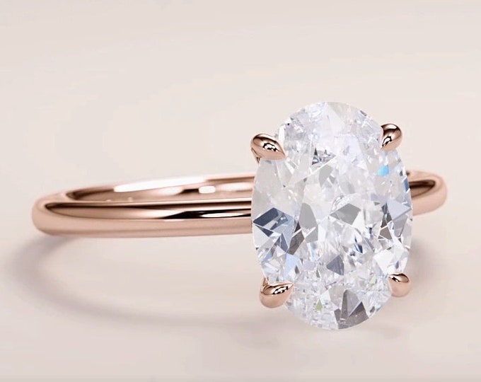 This Classic Solitaire oval engagement Ring features a 2 carat Oval Cut IGI Certified CVD lab grown diamond