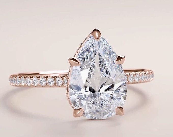 Unique Pear shaped 2.50 carat IGI Certified CVD lab grown diamond set in an invisible hidden halo gallery diamond pave setting