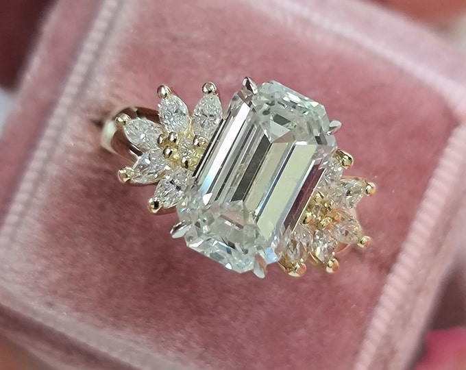 This unique 2 tone gold diamond cluster setting features a 4 carat Emerald Cut IGI Certified CVD  lab grown diamond