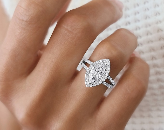 This unique Victorian style diamond split shank & halo 14K rose gold setting features a 1.50 carat IGI certified CVD lab grown marquise cut diamond and 0.65 carats accent diamonds