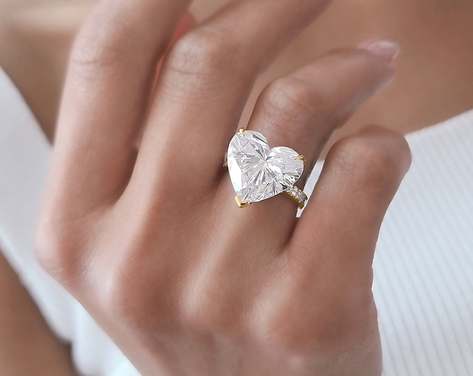 This Unique Rose Gold  Setting features a 9 Carat Heart Shaped IGI Certified CVD lab grown diamond accentuated with 0.64 carats side stones