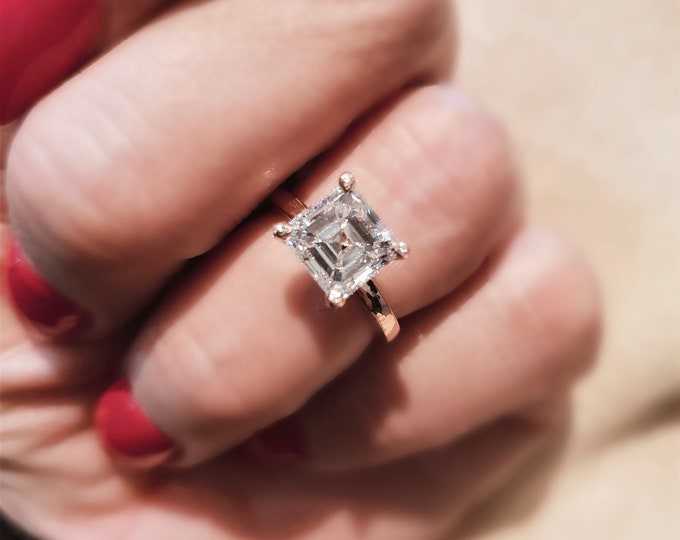 IGI Certified 2.50 Carat Asscher Cut CVD lab grown Diamond set in a unique rose gold setting with accent diamonds running up the prongs