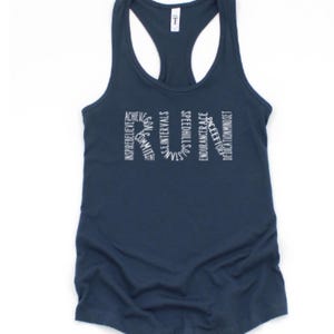 May include: A navy blue tank top with the word "RUN" spelled out in white lettering. The letters are made up of words related to running, such as "achieve", "inspire", "believe", "strength", "endurance", and "dedication".