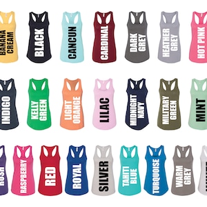May include: A collection of 24 racerback tank tops in various colors, including purple, indigo, banana cream, black, raspberry, kelly green, red, light orange, cancun, silver, lilac, cardinal, tahiti blue, midnight navy, turquoise, military green, heather grey, warm grey, mint, and hot pink. Each tank top has a different color and a white text label with the color name.