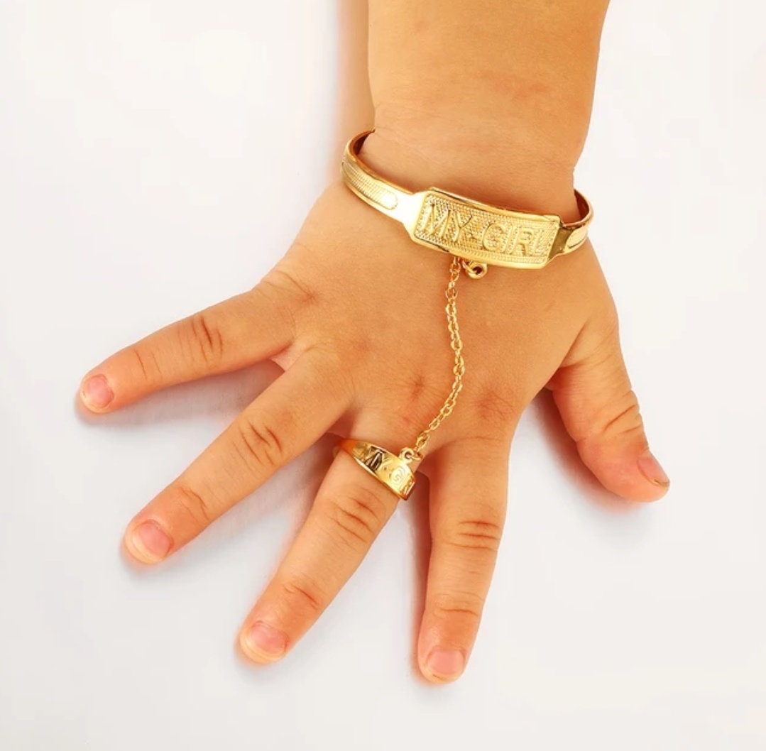 Cute Baby Girl Trying on a Lot of Finger Rings and Bracelets, Bijou Jewelry  Stock Image - Image of annulus, finger: 229708665
