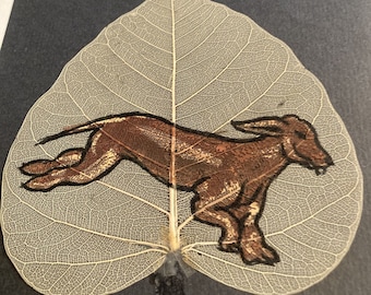 My Dog hand painted on a real tree leaf.                                    Leaf55greyhound