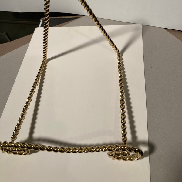 Bowl Hanger Scroll Back 6 1/4" x 6" x 5 1/2"  Twisted Brass wire.      BOL410