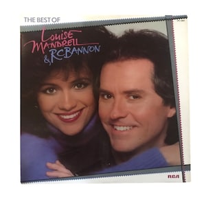 May include: A vinyl record album cover featuring a photo of Louise Mandrell and RC Bannon. The album title is "The Best of Louise Mandrell & RC Bannon".