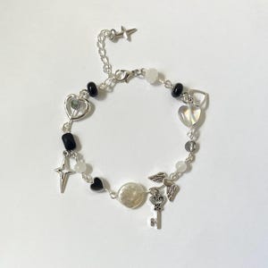 Black Angel Wing Handmade Beaded Bracelet. Glass beads,Y2K beads, fairy,stars,hearts, key to my heart, simple, fairycore,cottagecore,silver