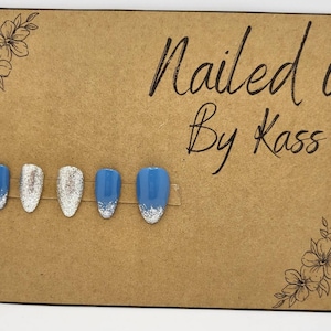Medium length almond blue and silver glitter gel press on nails made in customized shape and size.