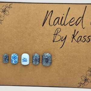 Short square blue snowflake and glitter gel press on nails made in custom size and shape.