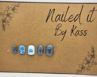 Short square blue snowflake and glitter gel press on nails made in custom size and shape.