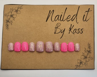 Pink short square gel press on nails with glitter made in any size or shape.