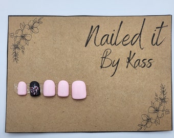 Short square light pink and black gel press on nails with polka dot accent nail made in custom size.