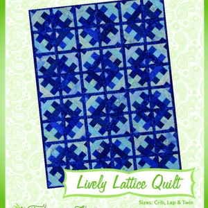 May include: A quilt pattern design called "Lively Lattice Quilt" with a blue and white color scheme. The pattern is made up of squares with a cross pattern in the center. The quilt is shown on a white background with a green paisley pattern border. The text "Fun & Done! Quilting" is at the top of the image. The text "Fairy Lake Quilt Designs" is at the bottom of the image.