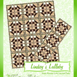 May include: A quilting pattern called "Lindsey's Lullaby" by Fairy Lake Quilt Designs. The pattern features a quilt block design with brown, white, and green squares. The pattern is available in sizes: Runner, Crib, Lap and Twin.