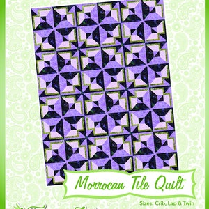 May include: A quilt pattern design called "Moroccan Tile Quilt" with a purple, white, and green color scheme. The pattern is made up of squares with a star-like design in the center. The quilt is available in crib, lap, and twin sizes. The design is from Fairy Lake Quilt Designs, home of "Fun & Done! Quilting".