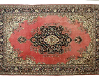 May include: A vintage Persian rug with a red background and intricate floral patterns in shades of blue, green, and cream. The rug has a central medallion and a border with a repeating design.