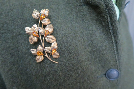 Large gold metal brooch, flower stem - image 9