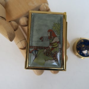 Set of Egyptian notebook and pill box in enameled metal