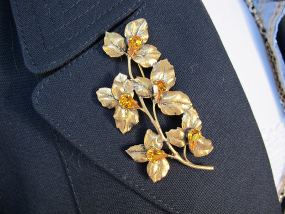 Large gold metal brooch, flower stem - image 1
