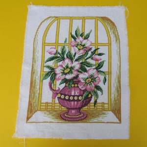 Vase embroidery in front of a window