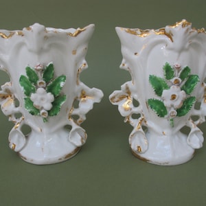 Pair of antique porcelain bridal vases