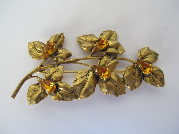 Large gold metal brooch, flower stem - image 2