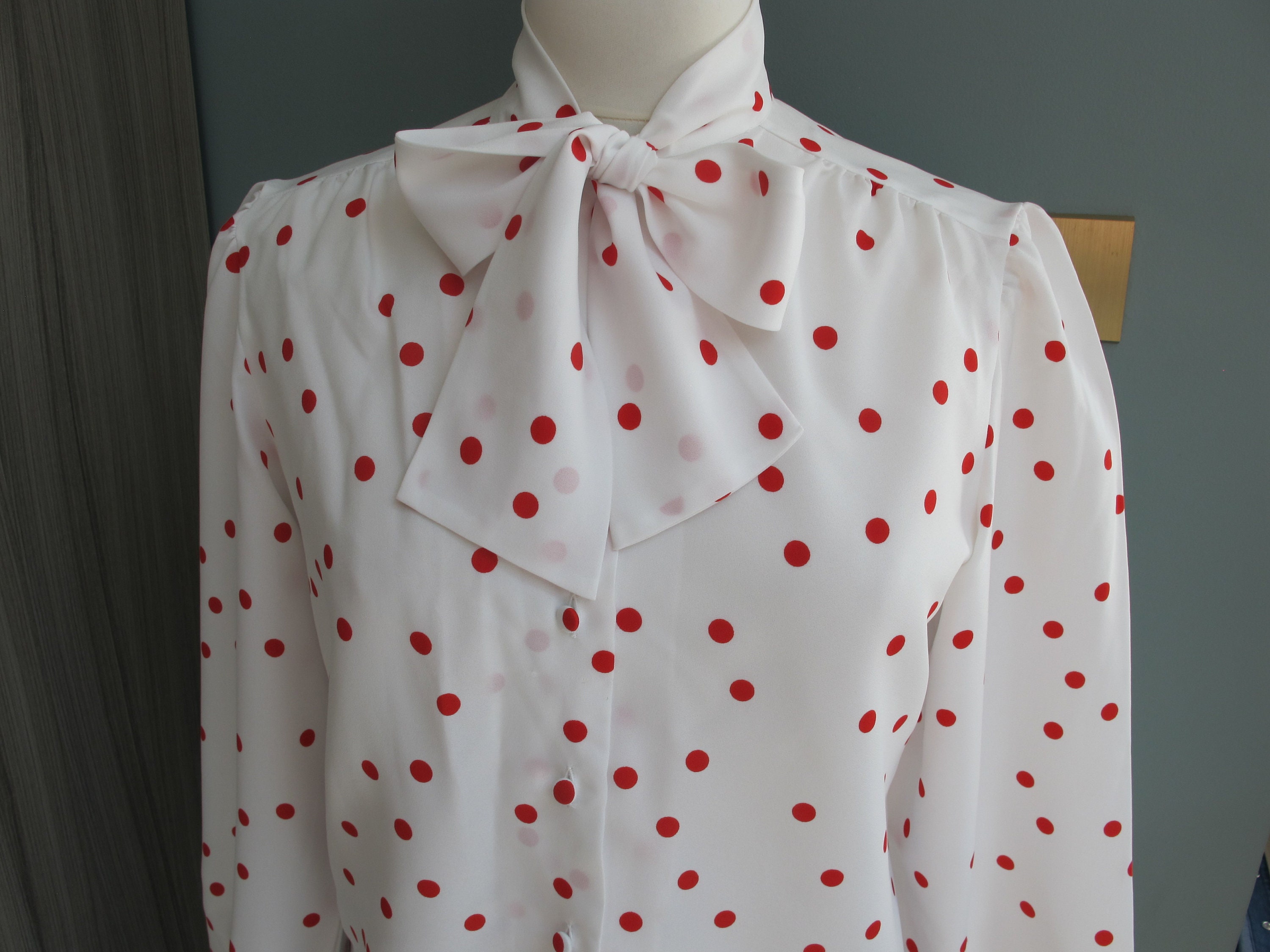 black and white polka dot blouse with bow