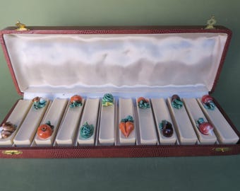 Set of 12 ceramic knife rests with vegetable motif