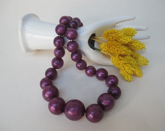 Old necklace of large purple pearls