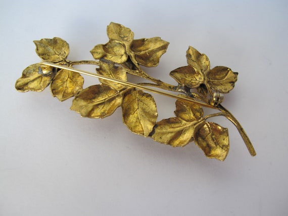 Large gold metal brooch, flower stem - image 3