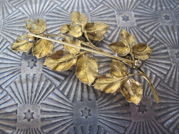 Large gold metal brooch, flower stem - image 7
